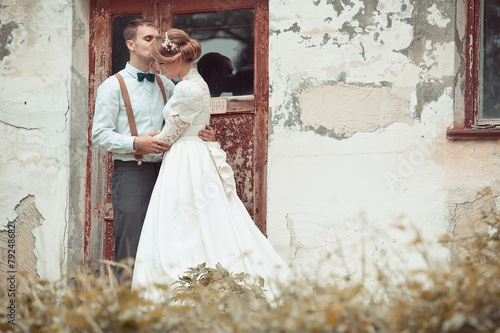 bride and groom near the old build