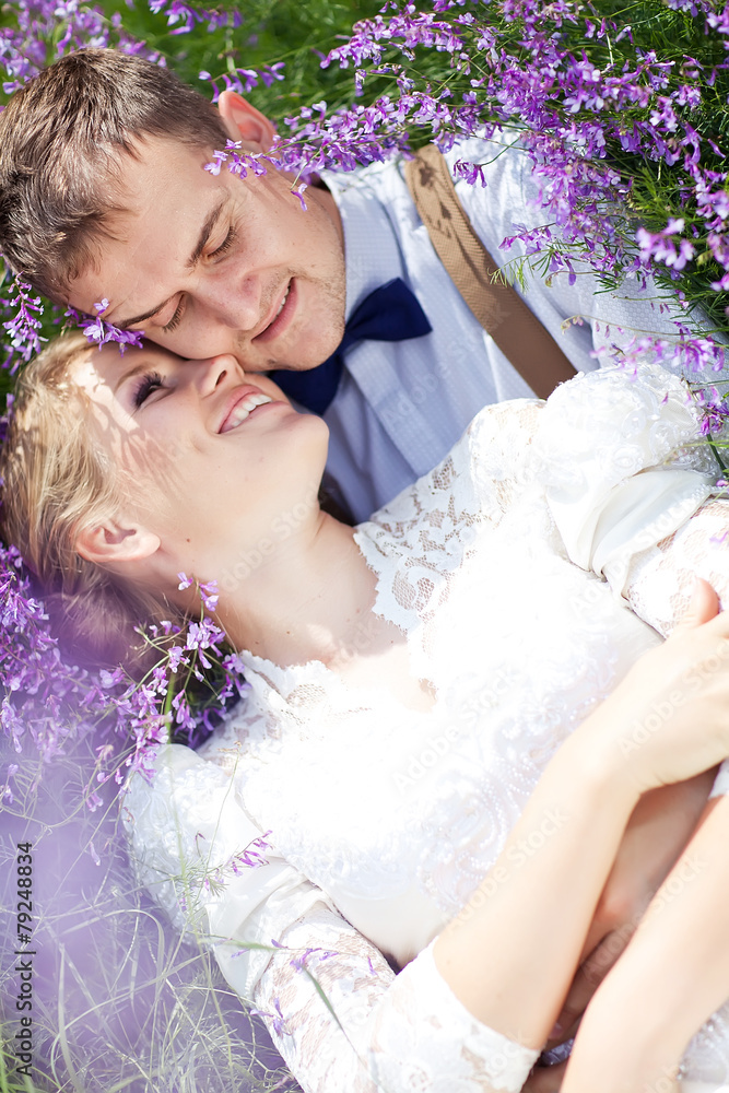 bride and groom in flower garden bride and groom in flower garden