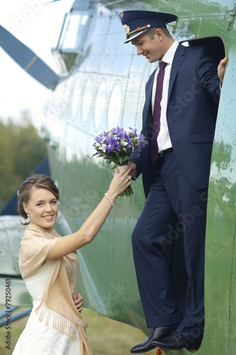 Wedding couple in love vintage aircraft photo