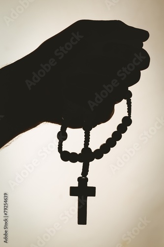 Fotografie, Obraz Hand holding rosary beads