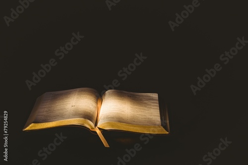 Light shining on open bible