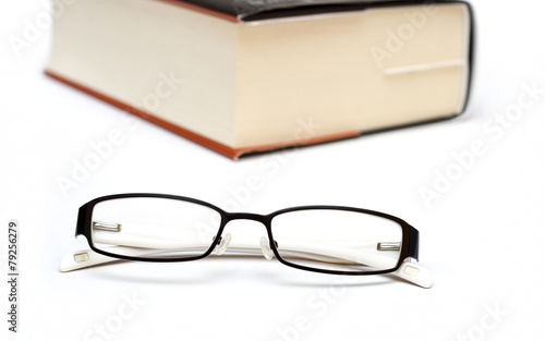 Thick book and glasses