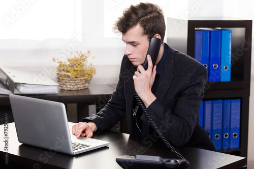 business man call someone