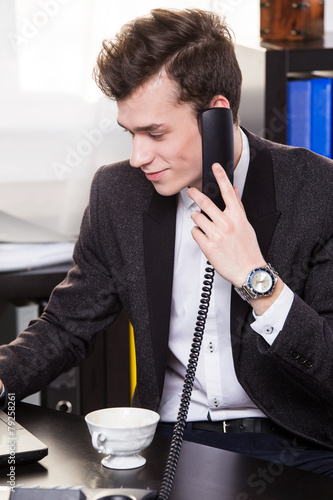 business man call someone