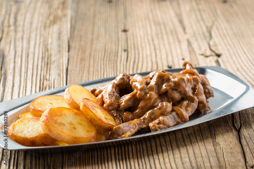 Beef Stroganoff, strips of beef in sour cream served with crisp Beef Stroganoff, strips of beef in sour cream served with crisp
