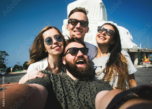Multiracial group of  friends make selfie traveling in Asia