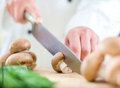 Chef chopping mushrooms