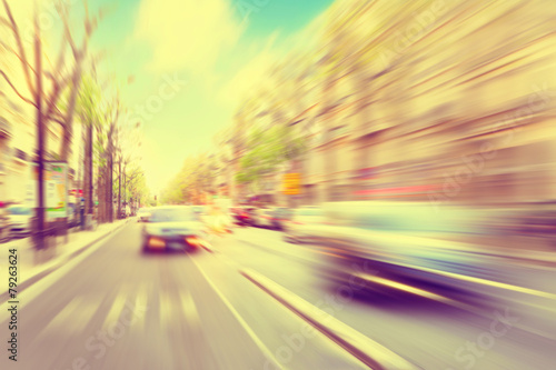 Cars in motion blur on the street.
