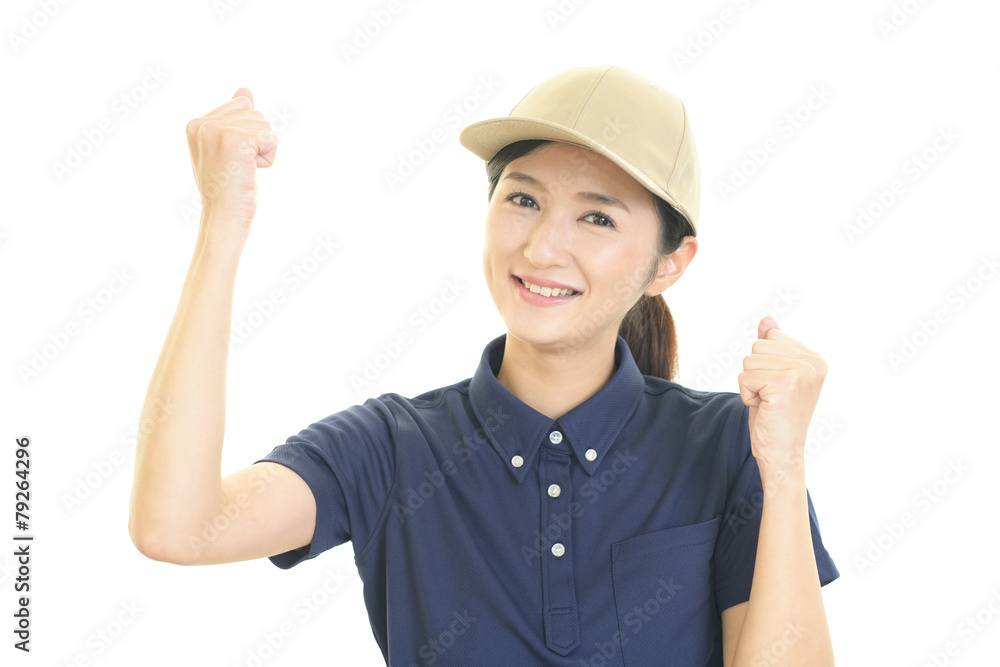 ガッツポーズの女性労働者