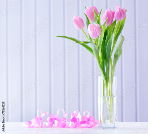 Fototapeta Naklejka Na Ścianę i Meble -  Beautiful pink tulips in vase with decorative hearts