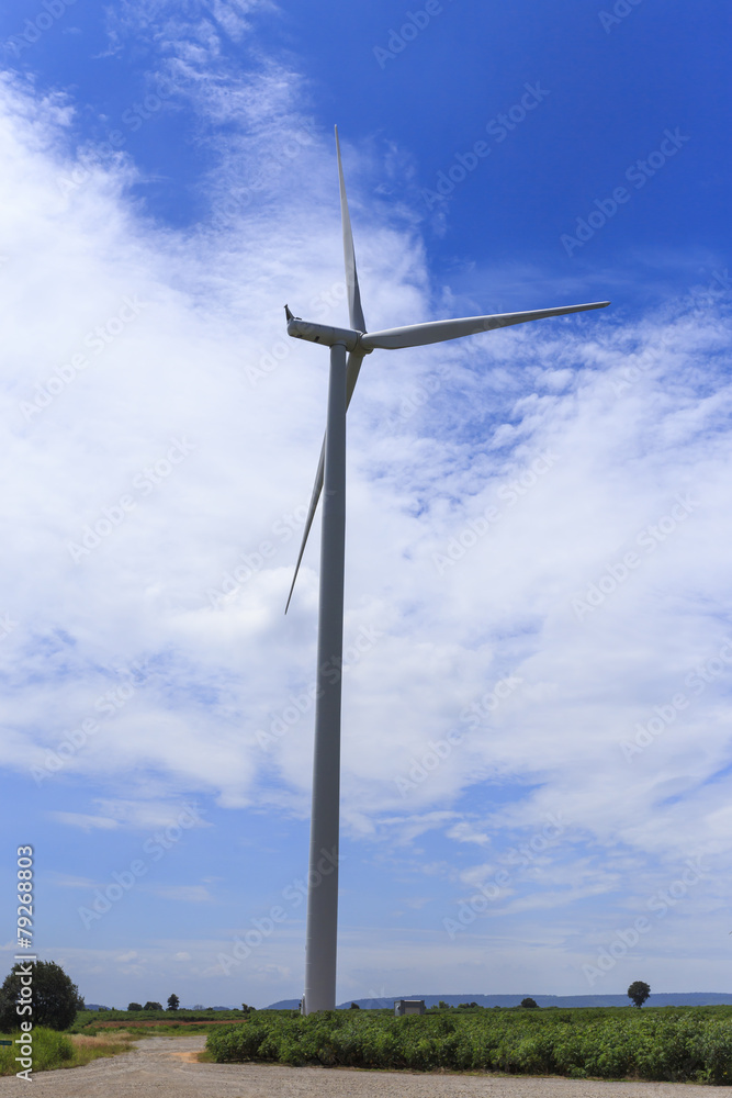 Obraz premium Wind Turbine for alternative energy on background blue sky .