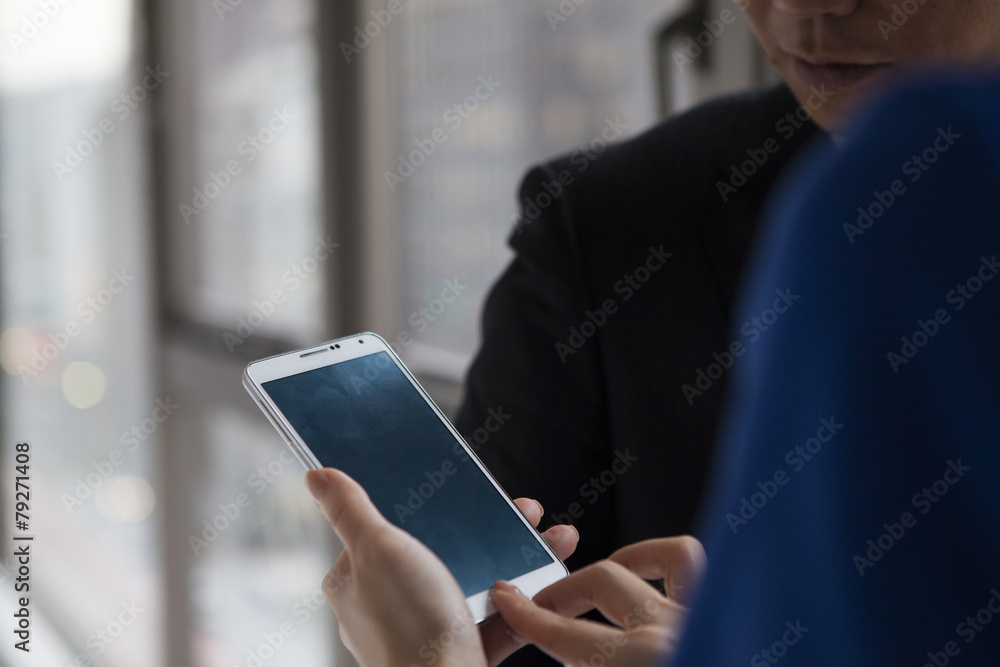 Man is peek mobile phone Man is peek mobile phone