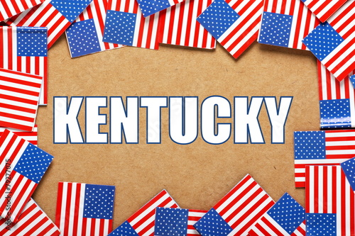 The title Kentucky with a border of USA flags