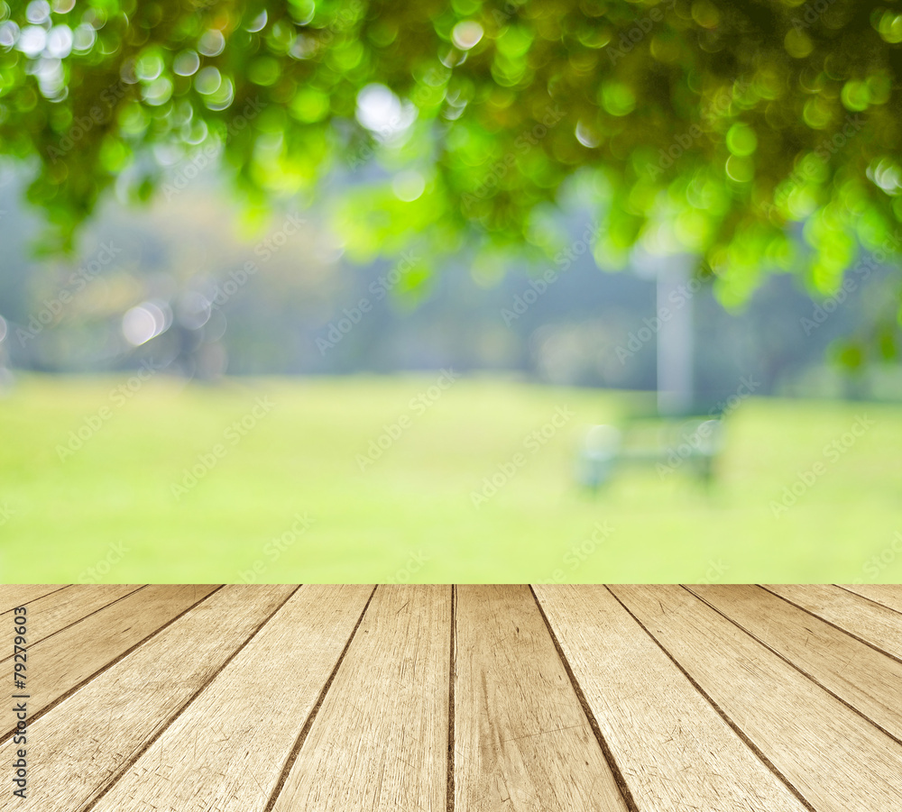 Perspective wood over blur trees with bokeh background Perspective wood over blur trees with bokeh background