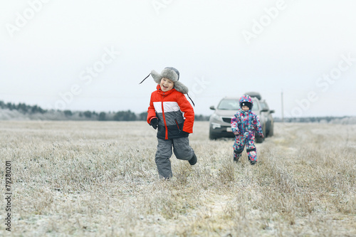 children playing in the winter field