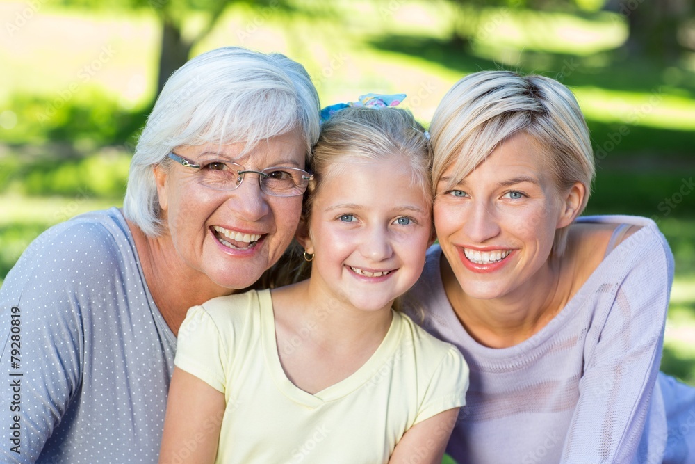 Smiling family looking at the camera