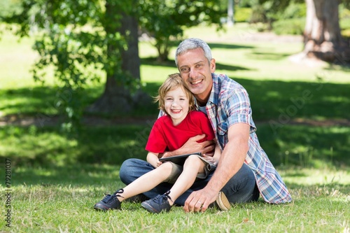 Happy father using tablet pc with his son © WavebreakMediaMicro