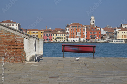 A red bench in Venice, Giudecca Isle photo