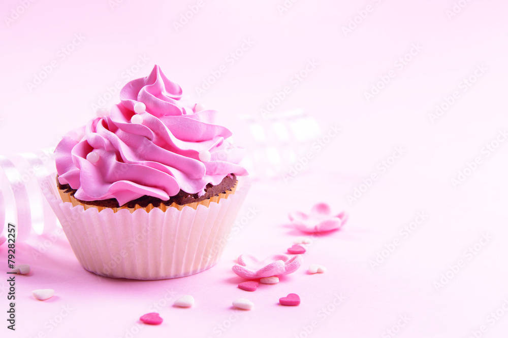 Delicious cupcake on pink background Delicious cupcake on pink background