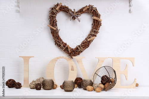 Romantic still life with wicker heart and design details