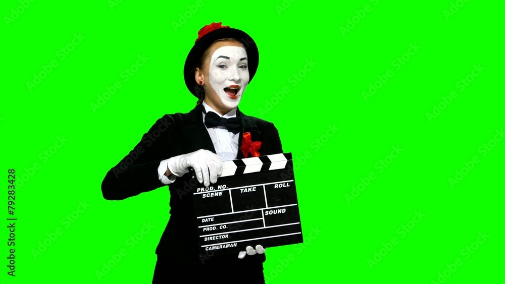 Woman mime uses the movie clapper on green screen Woman mime uses the movie clapper on green screen