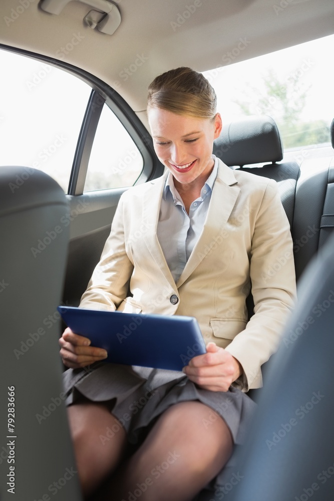 Businesswoman working on her tablet computer