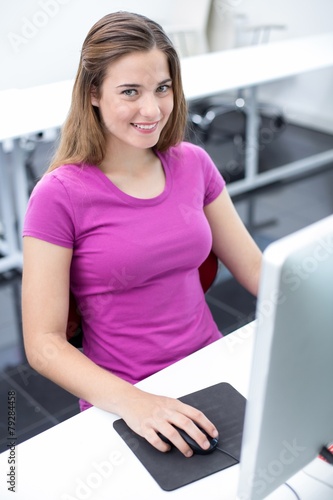 Free Download Student smiling at camera in computer class - GFXLoad