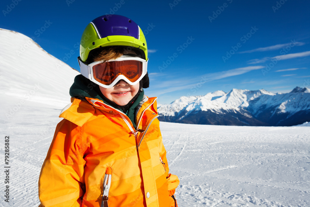 Close-up view of boy wearing ski mask on ski-track