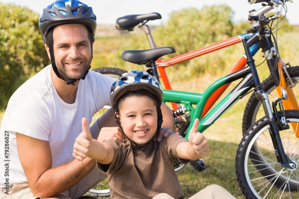 Naklejka premium Father and son on a bike ride