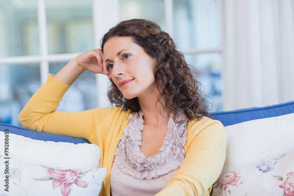 Pretty brunette relaxing on the couch