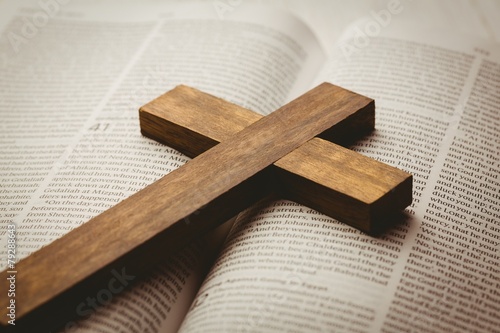 Open bible and wooden cross photo
