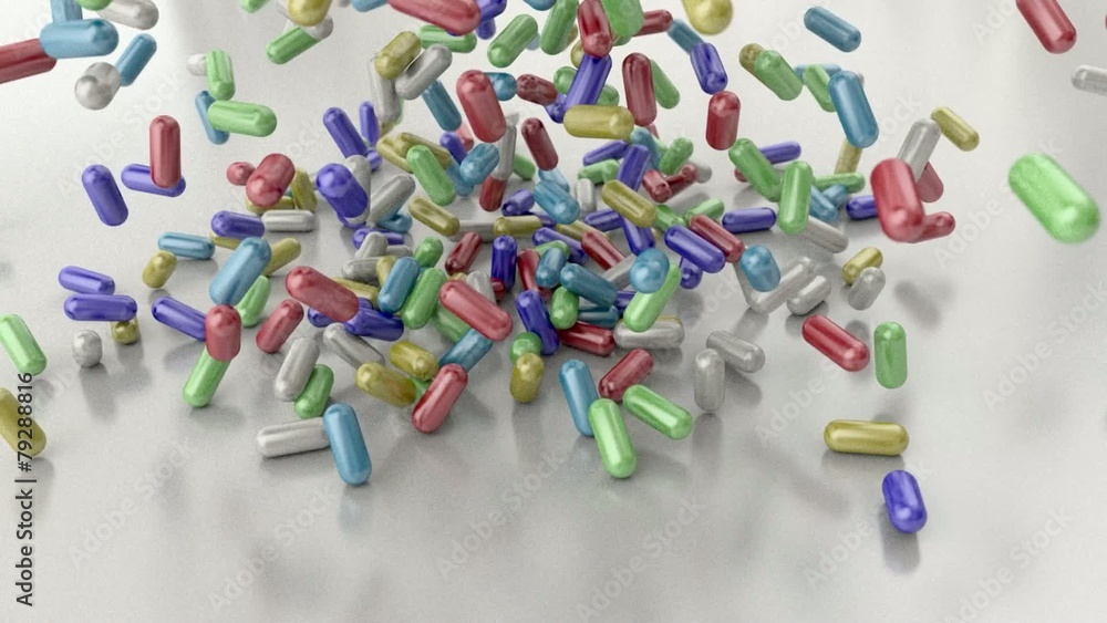 Pills drugs capsules falling on white table counter top slow mot Pills drugs capsules falling on white table counter top slow mot
