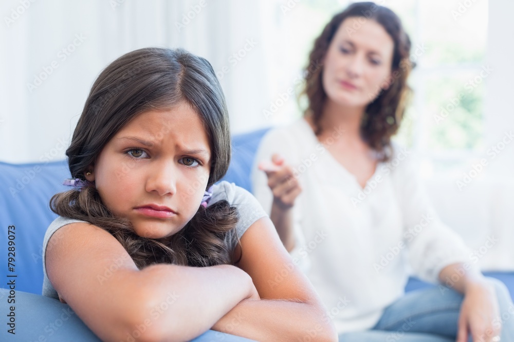 Upset mother looking at her daughter Upset mother looking at her daughter