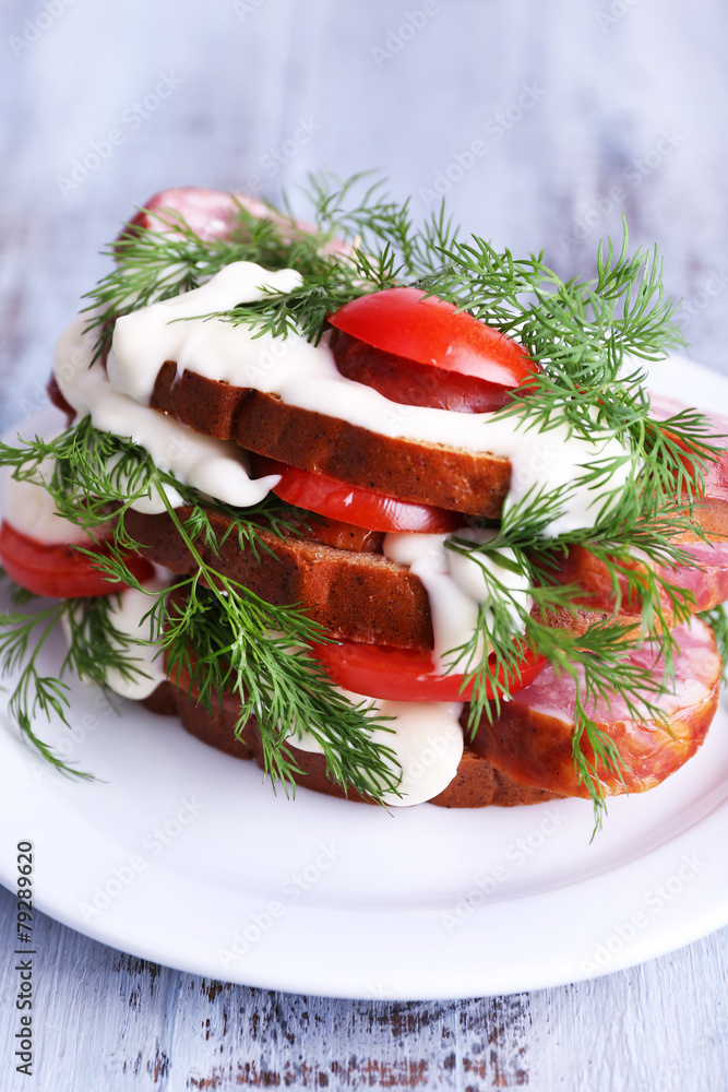 Sandwich with sausage, tomato and mayonnaise Sandwich with sausage, tomato and mayonnaise