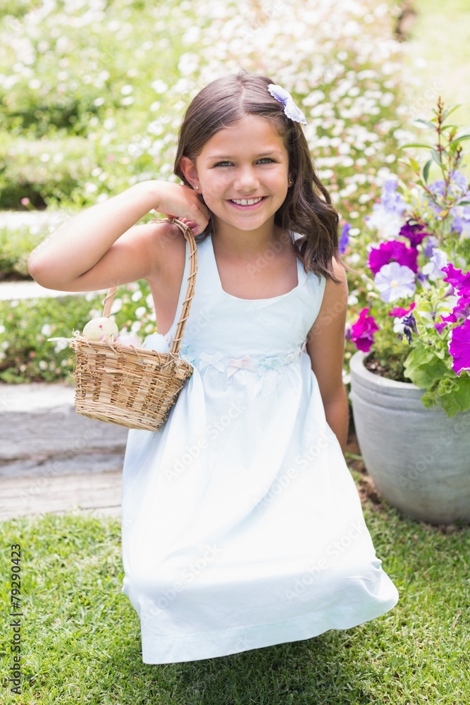 Fototapeta premium Happy girl collecting easter eggs