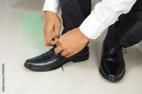 Man tying shoes