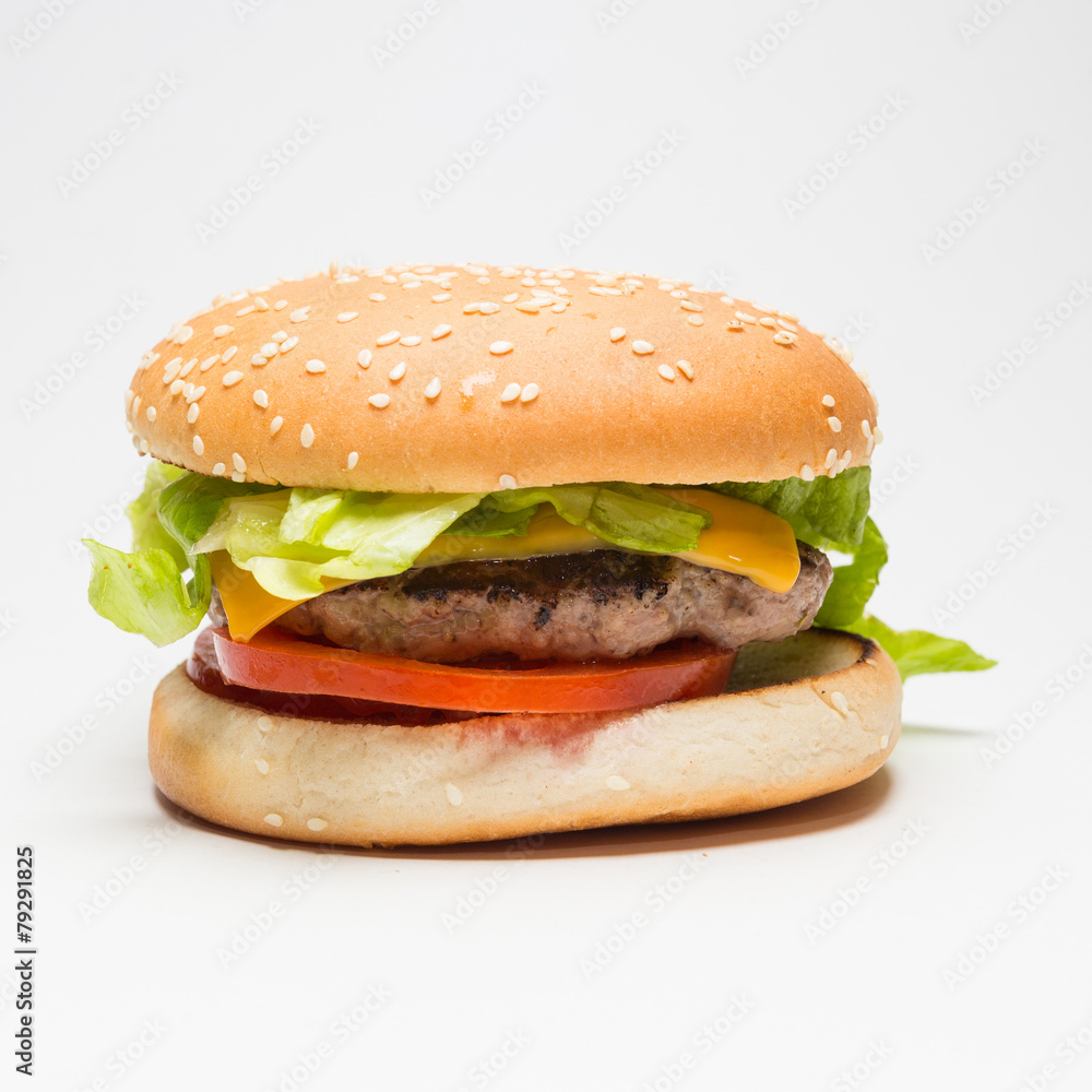 Classic hamburger with salad , cheese and tomatoes Classic hamburger with salad , cheese and tomatoes