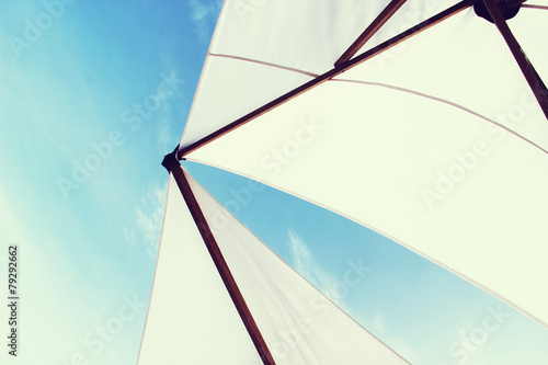 beach umbrella or sail on a yacht with blue sky. vintage effect