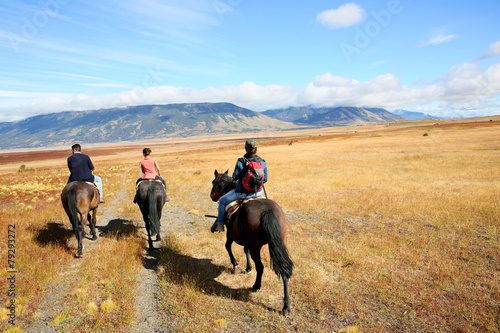 People riding horses in Patagonian steppe