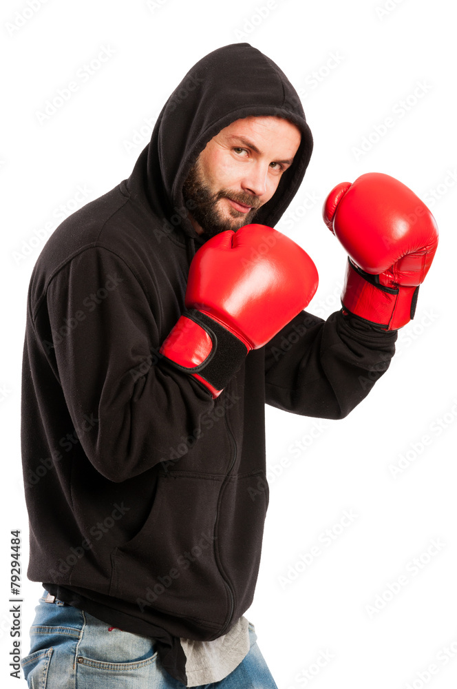Amateur boxer wearing a hoodie and gloves Amateur boxer wearing a hoodie and gloves