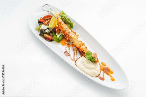 Fried king shrimps on white plate