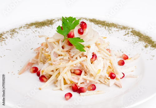 Salad with squid, onion, apple and pomegranate