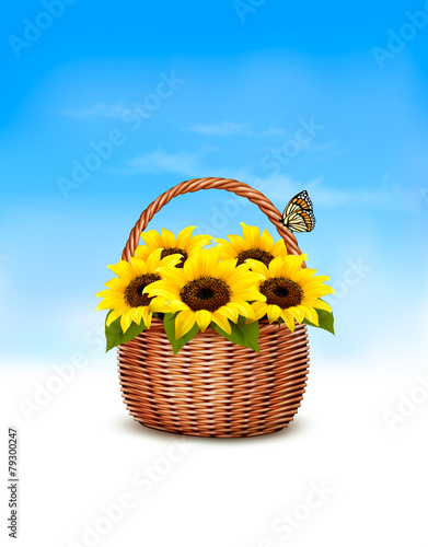 Fototapeta Naklejka Na Ścianę i Meble -  Spring background. Basket full of sunflowers and a butterfly. Ve
