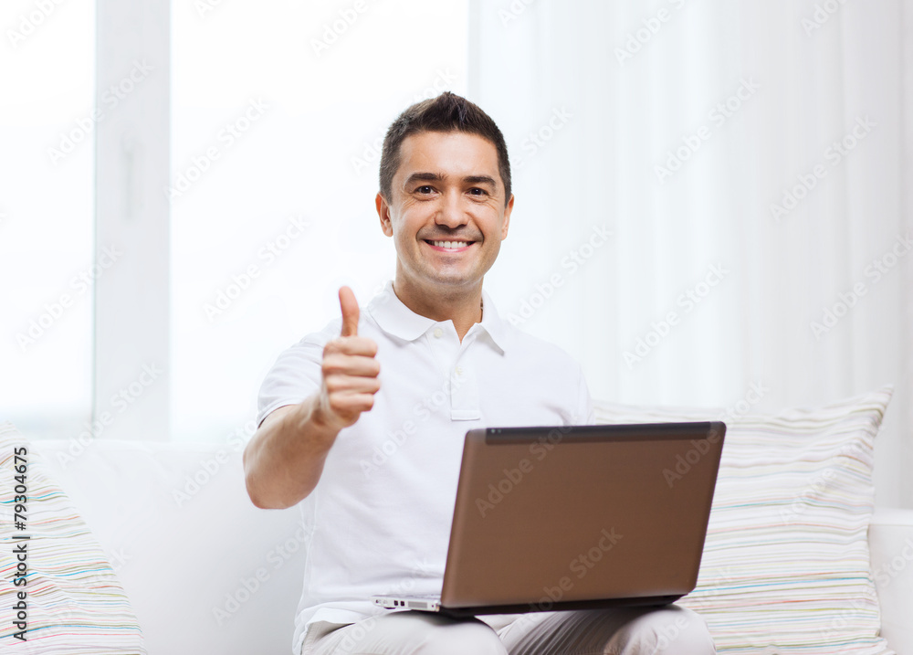 happy man working with laptop computer at home happy man working with laptop computer at home