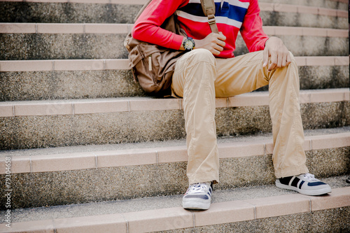 young man sitting on the stairs