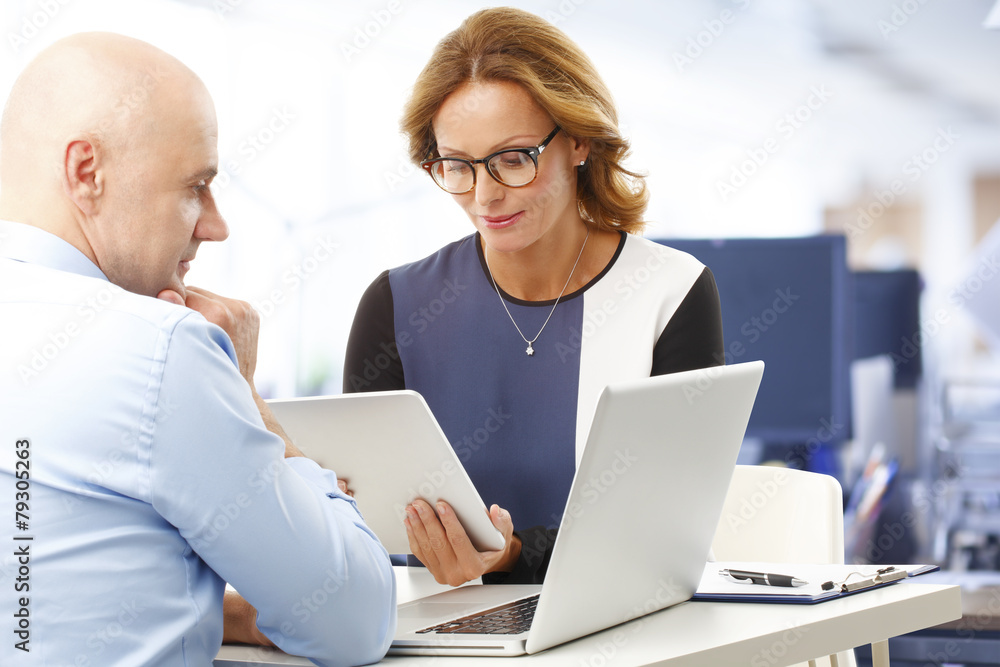 Business team working with digital tablet and laptop Business team working with digital tablet and laptop
