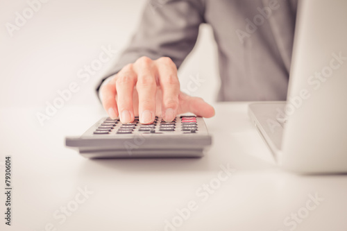 Closeup of businessman hands typing on laptop computer