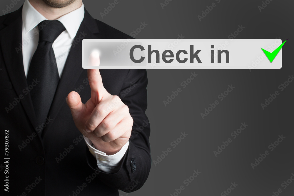businessman pressing button check in businessman pressing button check in