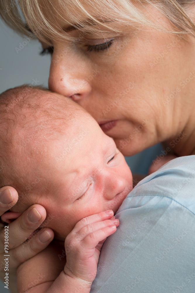 portrait of a newborn baby boy in his mother's shoulder portrait of a newborn baby boy in his mother's shoulder