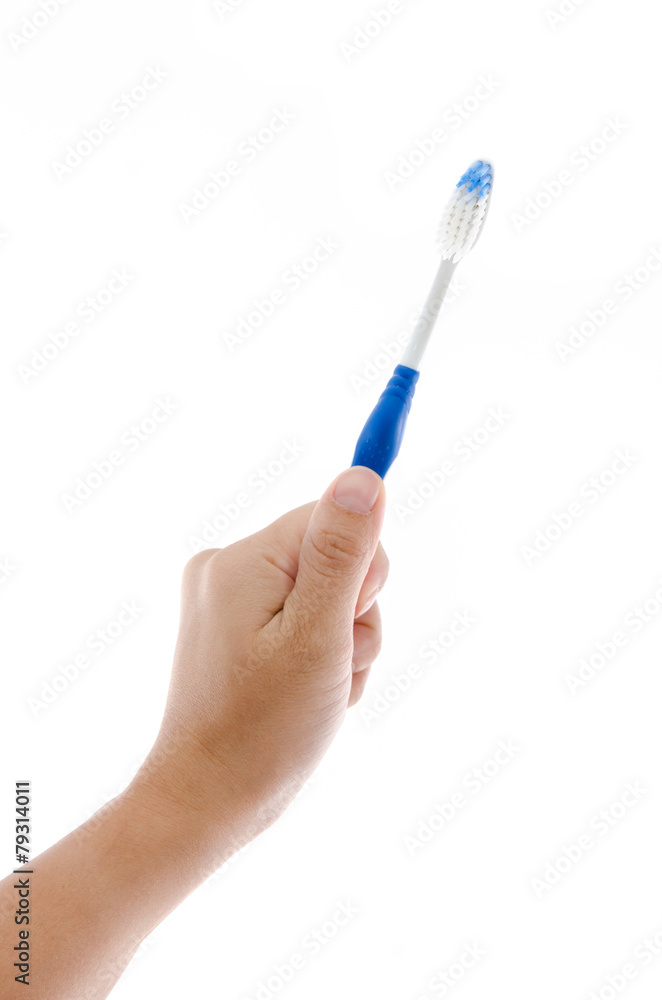 Hand holding toothbrush Hand holding toothbrush